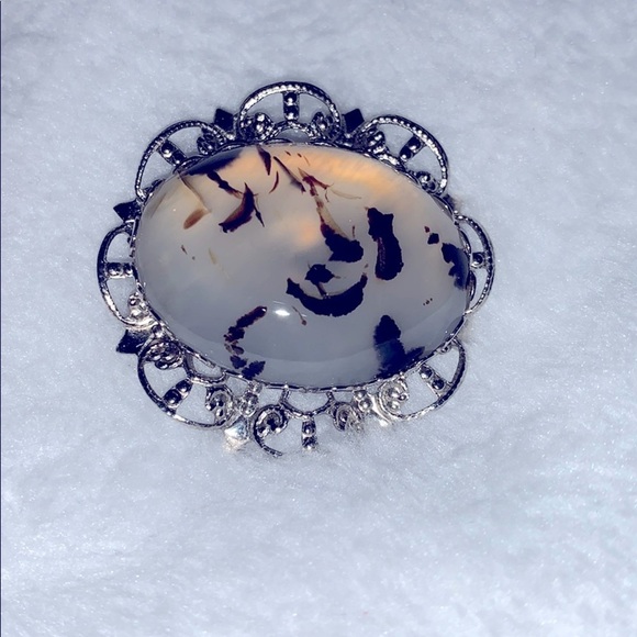 Jewelry - Translucent w/ black accents stone in a silver pin